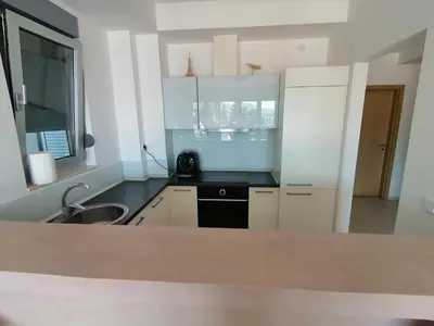 a kitchen with a sink and a counter top at Apartman Sara in Pržno