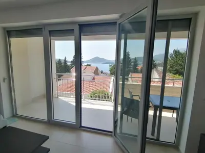a view from a room with sliding glass doors at Apartman Sara in Pržno