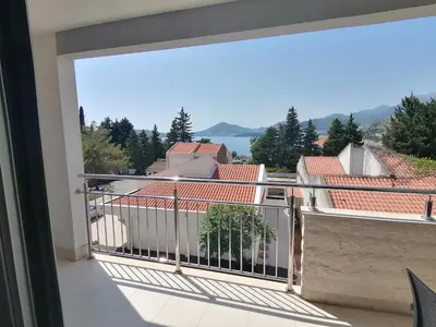a balcony with a view of a city at Apartman Sara in Pržno