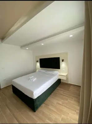 a bedroom with a large white bed in a room at Heaven Home in Ulcinj