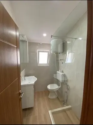 a small bathroom with a toilet and a sink at Heaven Home in Ulcinj