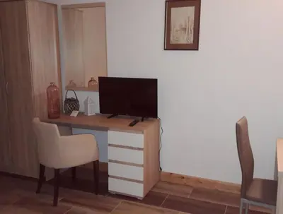 a desk with a television on top of it at Apartments Zec in Čanj