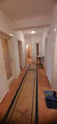 a hallway with a rug on the floor of a room at Apartmani Paradise in Sutomore