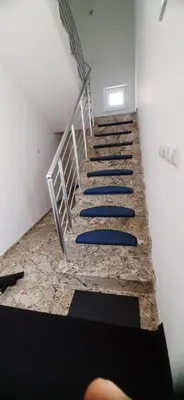 a group of stairs with blue surfboards on them at Apartmani Paradise in Sutomore
