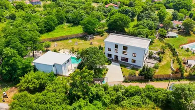an aerial view of a house with a yard at The Rock Star's Villa with Private Pool and Beach in Danilovgrad
