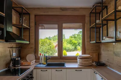 a kitchen with a sink and a window at The Rock Star's Villa with Private Pool and Beach in Danilovgrad