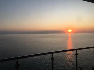 a sunset over the ocean from a cruise ship at Аpartment 555 in Dobra Voda