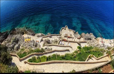 an aerial view of a resort on a hill next to the ocean at Аpartment 555 in Dobra Voda