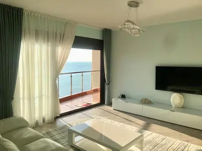 a living room with a view of the ocean at Аpartment 555 in Dobra Voda