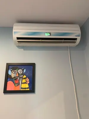 a wall mounted air conditioner in a ceiling with a picture at Apartment Serenada in Bar, Susanj