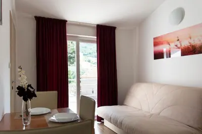 a living room with a couch and a table at Apartments Đurović in Petrovac na Moru