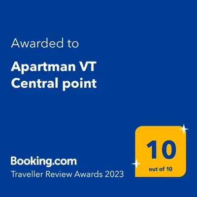 a yellow square with the text awarded to aprilanan v central point at Apartman VT Central point in Podgorica