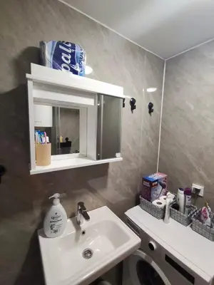 a bathroom with a sink and a mirror at Two-bedroom apartment with parking and sea view in Becici