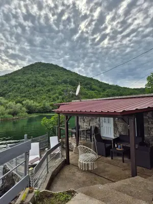 a gazebo with a view of a river at Old house, Skadar Lake in Cetinje