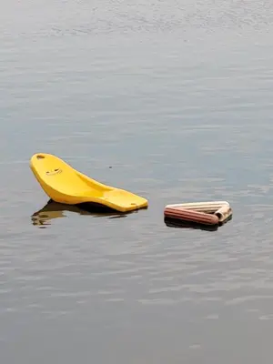 a yellow device and a cell phone in the water at Old house, Skadar Lake in Cetinje