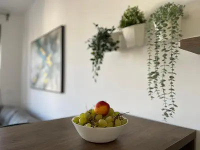 a bowl of fruit sitting on a wooden table at YOUR CHOICE in Bar