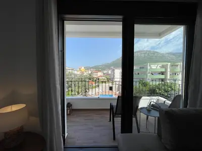 a living room with a view of a balcony at YOUR CHOICE in Bar