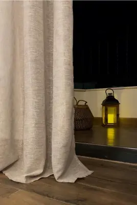 a window with a white curtain and a lantern at YOUR CHOICE in Bar