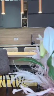 a room with a table and chairs and a plant at Becici stan in Budva