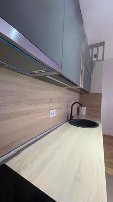 a kitchen with a sink and a counter top at Becici stan in Budva