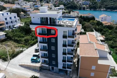 a building with a red circle on the side of it at Enchanted April in Utjeha