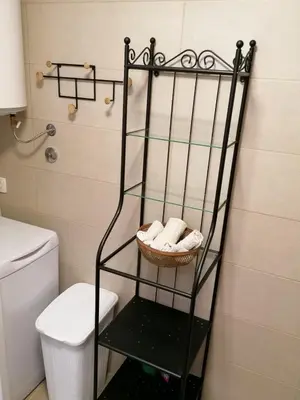 a bathroom with a towel rack next to a toilet at Apartment Centar in Buljarica