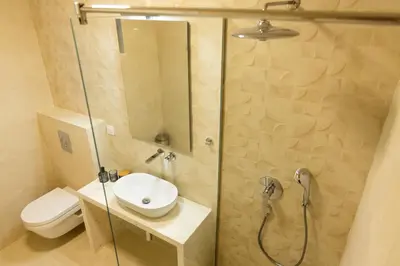 a bathroom with a shower with a toilet and a sink at Villa Forte Mare in Petrovac na Moru