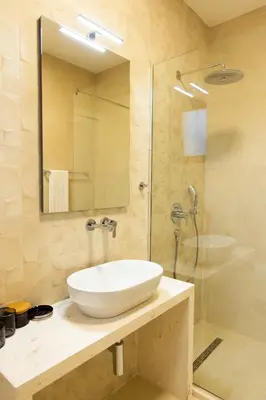 a bathroom with a sink and a shower at Villa Forte Mare in Petrovac na Moru