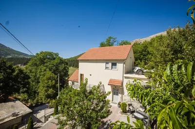 an aerial view of a white house with a red roof at Montana House Njeguši in Cetinje