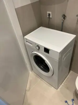 a washing machine in the corner of a bathroom at Lovely Partial Sea View one bedroom Flat in Horizon Residences A24 in Becici