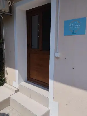 a wooden door on the side of a building at Apartment Cattaro magico in Kotor