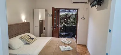 a bedroom with a bed with two towels on it at Apartment Cattaro magico in Kotor