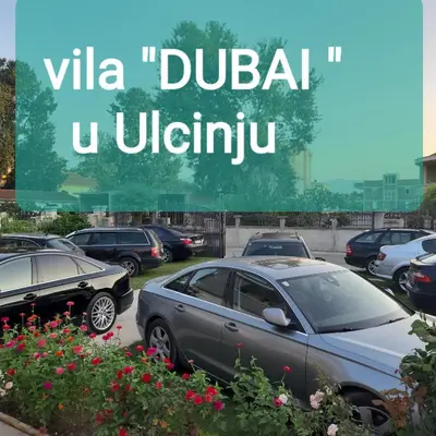 a group of cars parked in a parking lot at Vila DUBAI - ULCINJ VELIKA PLAŽA in Ulcinj