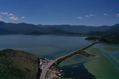an aerial view of a bridge over a lake at Lake House Buric in Vranjina