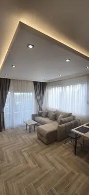 a large living room with a couch and tables at Deluxe Apartmani Vila Pejovic Sutomore in Sutomore