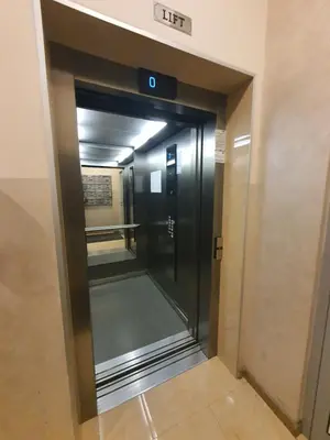 an elevator in a building with its door open at Clarissa apartment City Kvart in Podgorica