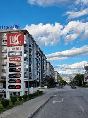 a sign on the side of a building on a street at Clarissa apartment City Kvart in Podgorica