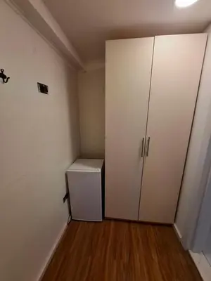a room with a white closet and a refrigerator at Titi Luxury&Spa in Ulcinj