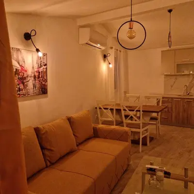 a living room with a couch and a table at The Apartment in Ulcinj