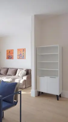 a living room with a couch and a white dresser at Silver Beachfront Becici in Becici