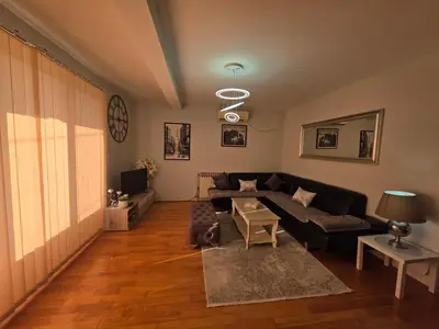 a living room with a couch and a table at Family apartment-DiLorena in Bar