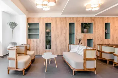 a living room with a couch and chairs at Hotel Olea in Ulcinj