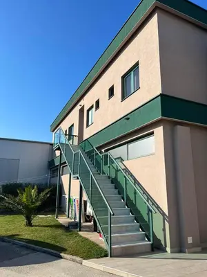 a building with a staircase next to a building at IPN ROOMs in Mahala