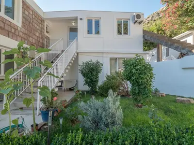 a view of a house from the garden at Tomy Garden House in Budva