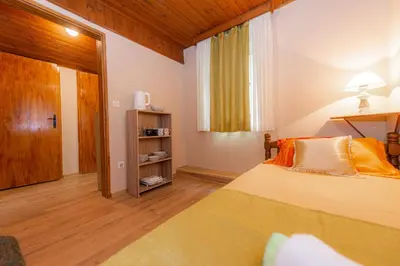 a bedroom with a bed and a window at BARBARA101 in Kotor