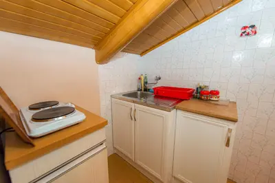 a small kitchen with a sink and a counter at BARBARA101 in Kotor