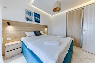 a bedroom with a large bed in a room at OLIVE GARDEN APARTMENT in Bar