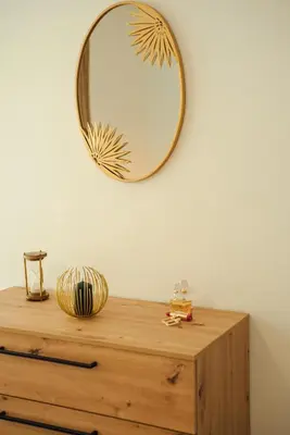 a mirror on a wall above a wooden dresser at Baia di Cattaro in Kotor