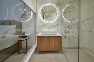a bathroom with a sink and a shower at Hotel Riva in Budva