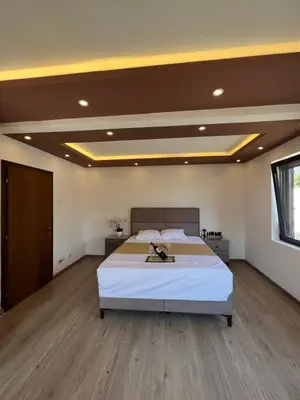 a bedroom with a large bed in a room at City Heart Apartments in Ulcinj